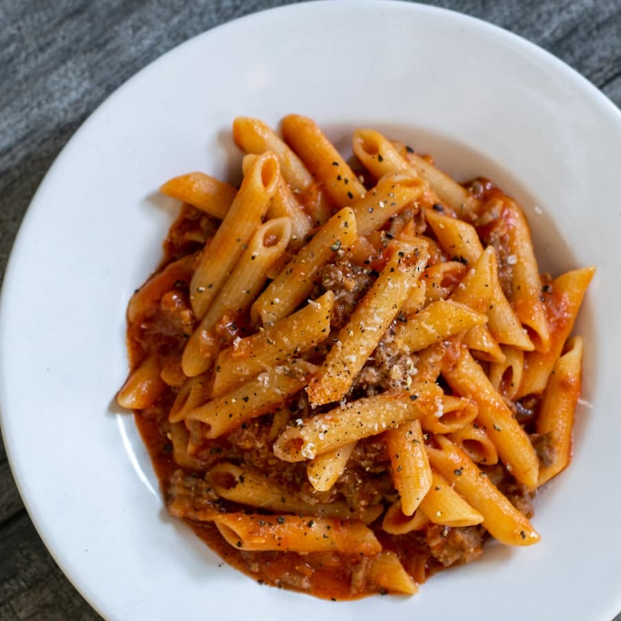 Penne in tomato sauce with parmesan and cracked pepper